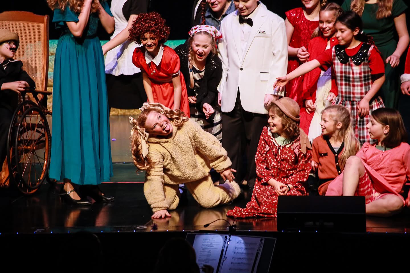 Kids performing on stage with joy